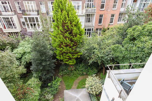 Zandbergen-Hotel-buiding-construction-white-window-mirror-door-balcony-wall-Backyard-Top-View-Green-Trees-view