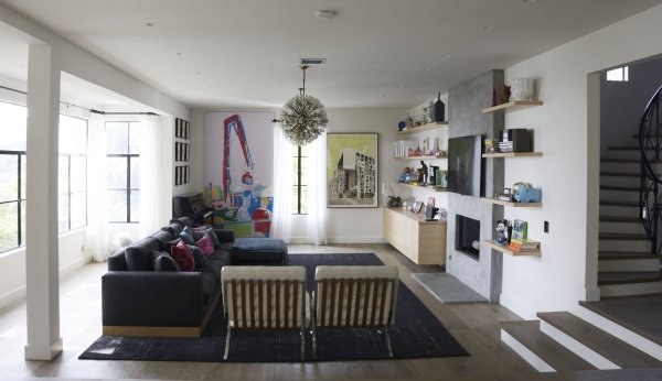 one-of-their-favorite-rooms-is-now-the-living-area-with-huge-open-windows-lots-of-light-and-a-tv-for-watching-netflix-bob-says-the-family-loves-movies-and-recently-watched-the-tower-records-documentary